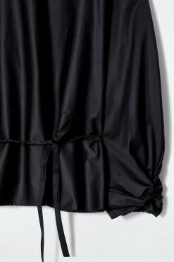 BLUSE MIT SCHÖSSCHEN UND KORDELZUG