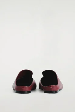 DRAPIERTE MULES AUS LEDER