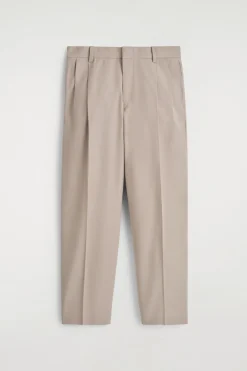 LOCKERE, SCHMAL ZULAUFENDE HOSE MIT FALTEN