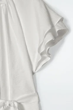 MEHRLAGIGE BLUSE MIT GÜRTEL