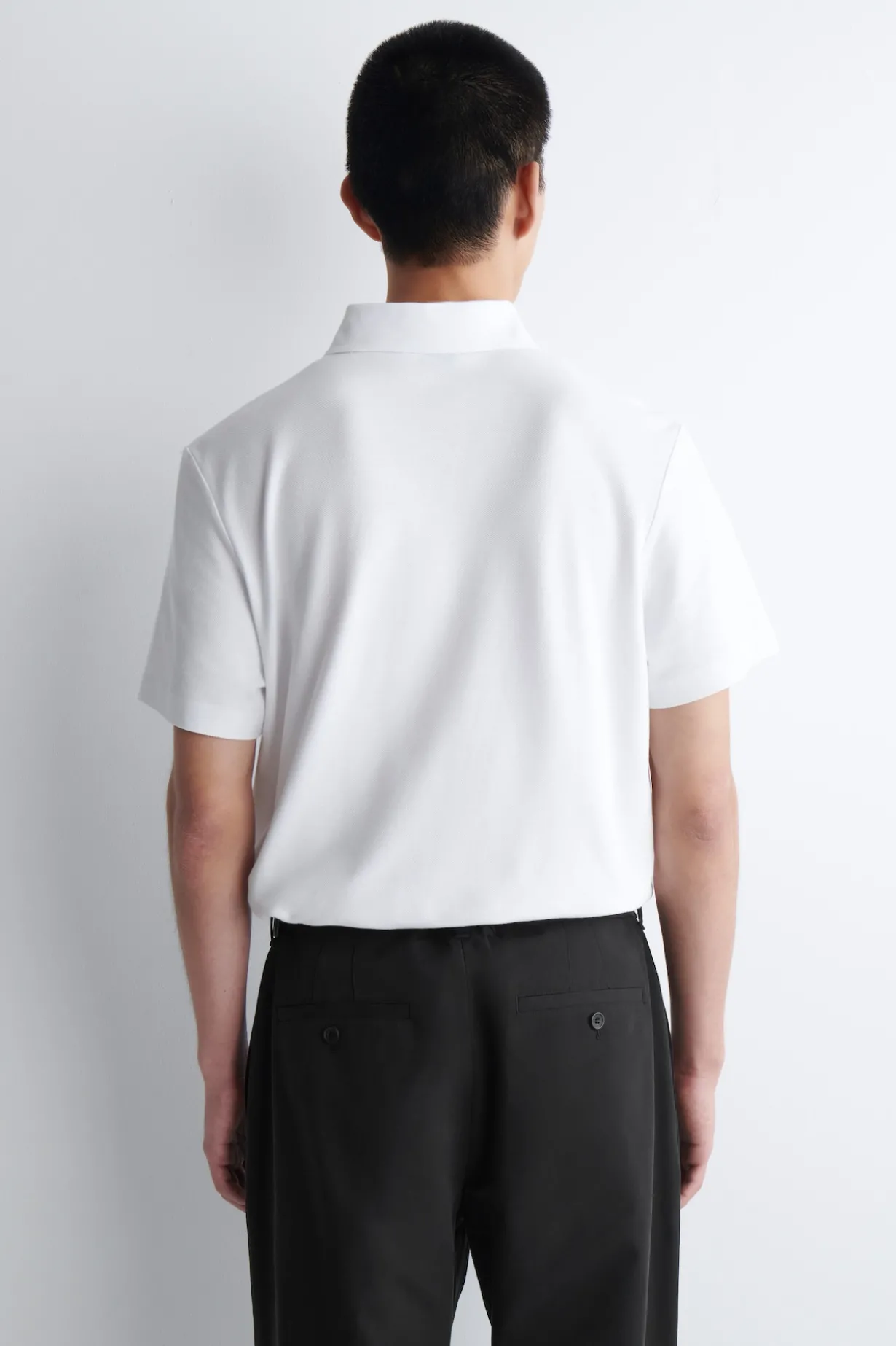 PIQUÉ-POLOSHIRT AUS TECHNISCHEM MATERIAL