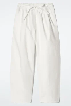 SCHMAL ZULAUFENDE BAUMWOLLHOSE MIT KORDELZUG